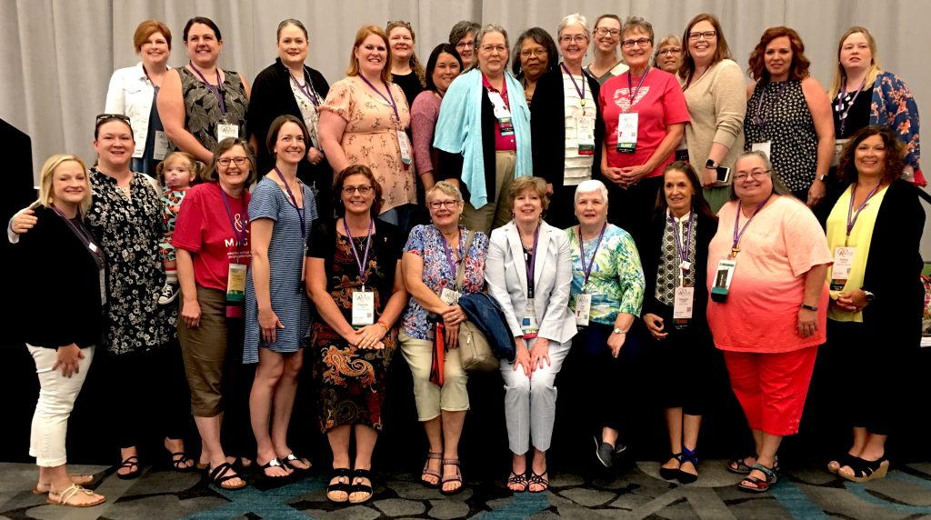 Phillips Theological Seminary female alums gather for a group photo at the 2019 General Assembly.