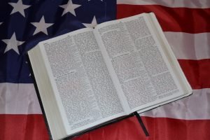 Christian Bible on an American Flag